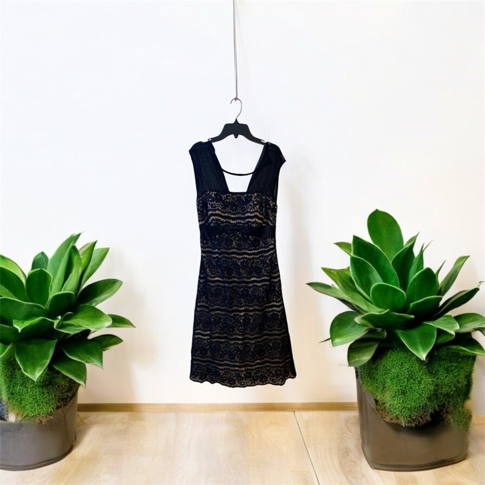 A black dress, used in good condition just missing a button in the back!